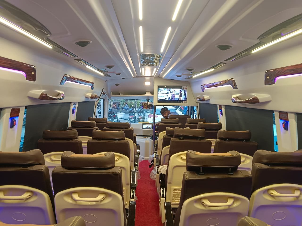 9 Seater Traveller by Prisha Tour Travels